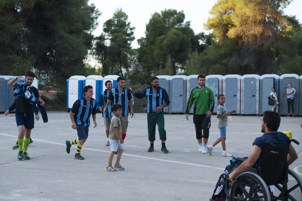 Refugees on the current football pitch in the Ritsona camp (Photo: Lighthouse Relief)